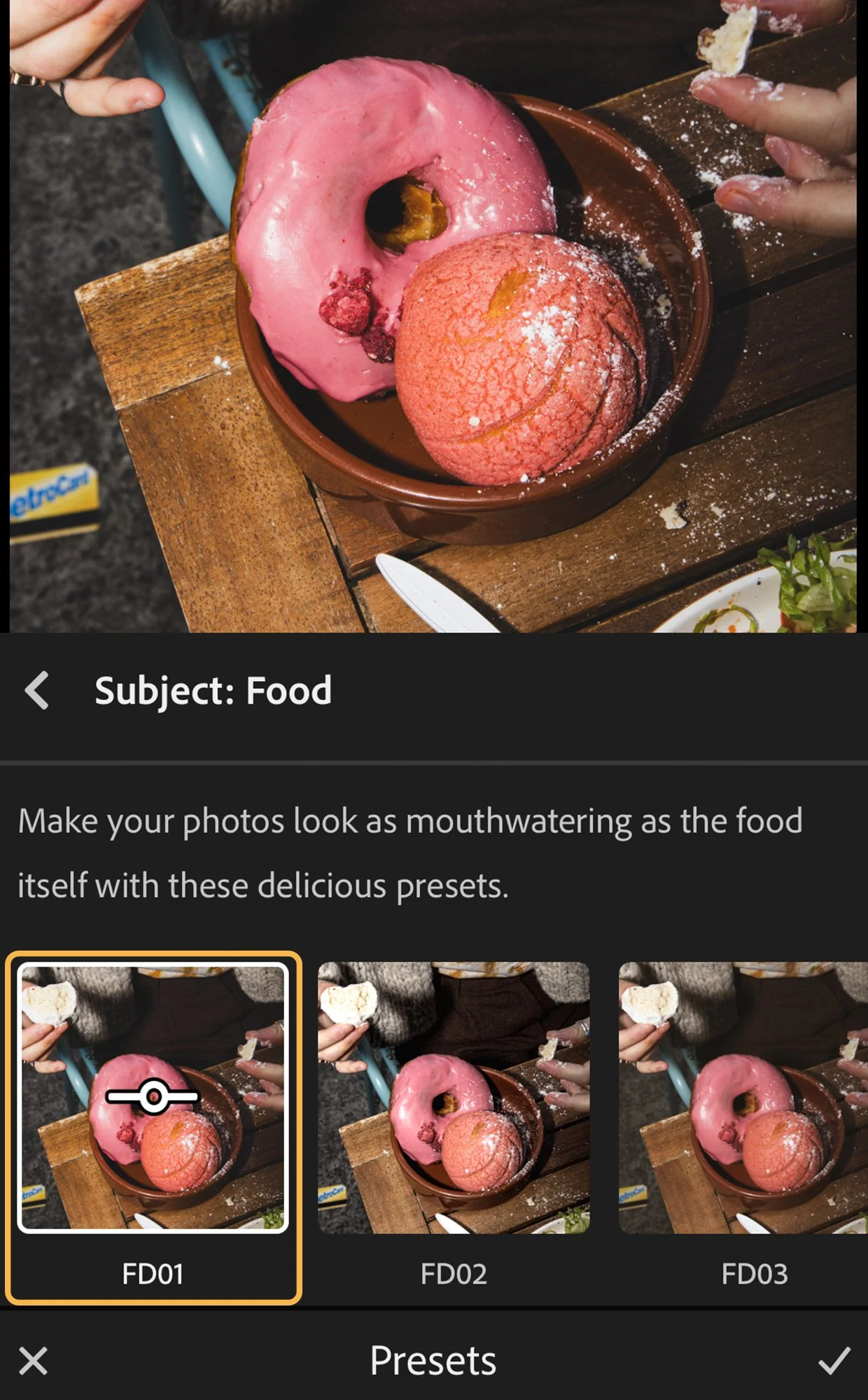 A bowl with a pink frosted donut and a pink ice cream scoop, both topped with powdered sugar, on a wooden table. Showing preset UI options.